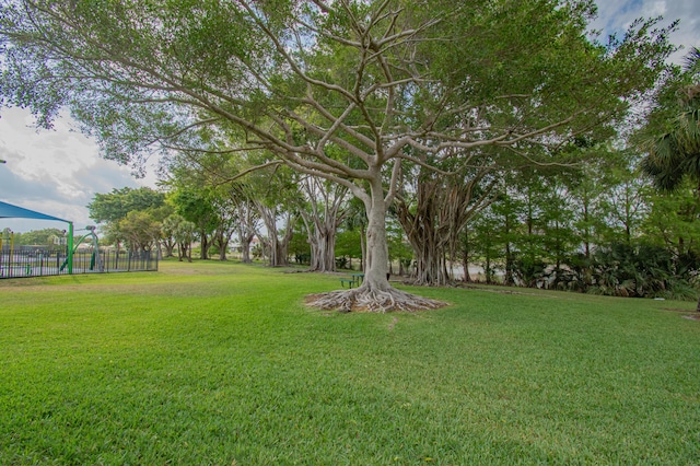 view of yard with fence and playground community