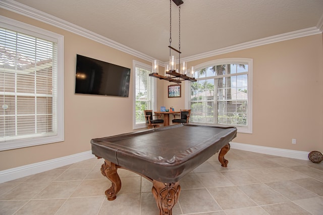 game room featuring crown molding, baseboards, light tile patterned flooring, and a textured ceiling