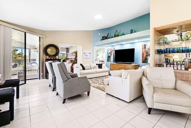 living area with vaulted ceiling and light tile patterned floors