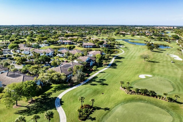 birds eye view of property with a residential view, a water view, and golf course view