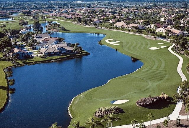 birds eye view of property with a residential view, view of golf course, and a water view