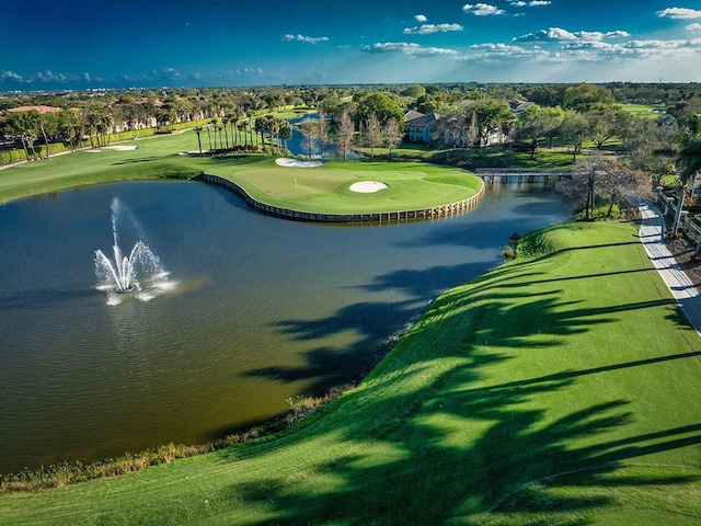 view of property's community featuring a water view and view of golf course