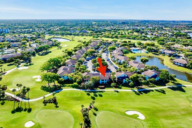 drone / aerial view featuring a residential view, a water view, and view of golf course