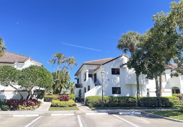 view of property featuring uncovered parking