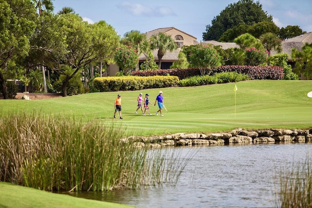 7290 Clunie Pl Unit 14404, Delray Beach, FL 33446 - view of community featuring a water view, a yard, view of golf course, and an area to practice putting
