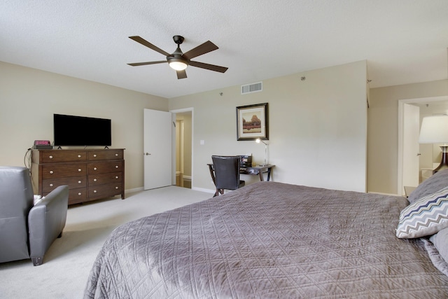 bedroom with baseboards, visible vents, ceiling fan, a textured ceiling, and carpet floors