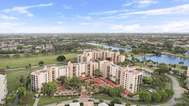 drone / aerial view featuring a water view and a view of city