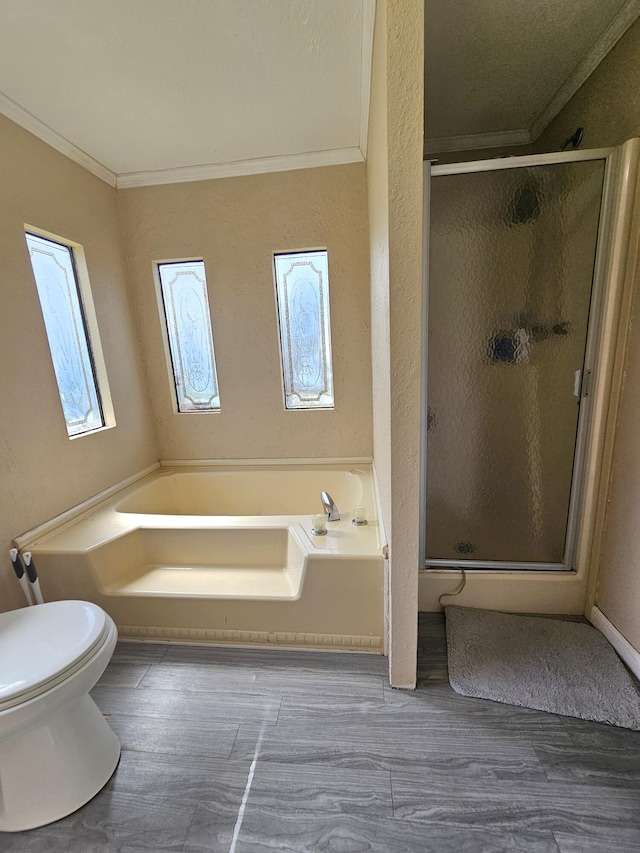 full bathroom with toilet, wood finished floors, a bath, a stall shower, and crown molding