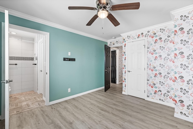 unfurnished bedroom featuring baseboards, ceiling fan, ornamental molding, ensuite bathroom, and light wood-type flooring