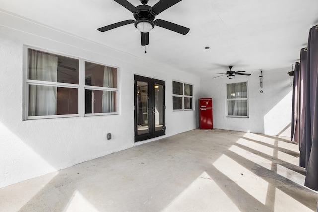 view of patio / terrace featuring french doors and ceiling fan