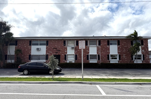 view of property with uncovered parking