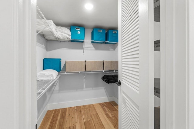 spacious closet with light wood-style flooring