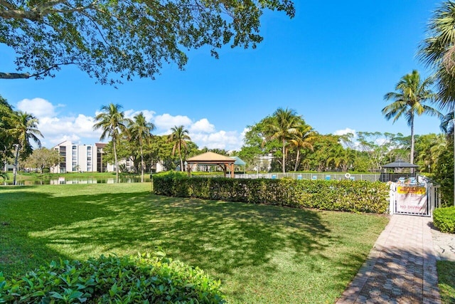 surrounding community with a yard and a gazebo