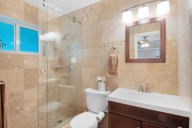 full bathroom featuring vanity, a shower stall, tile walls, toilet, and backsplash