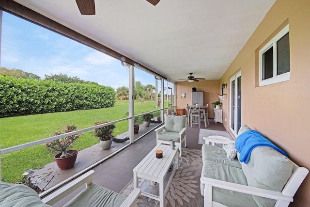 sunroom with a ceiling fan