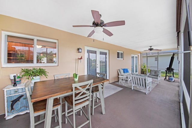 view of patio featuring an outdoor living space, french doors, outdoor dining area, and ceiling fan