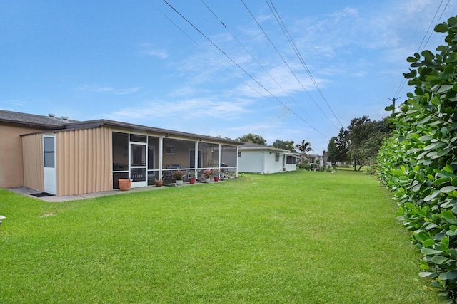 view of yard featuring a sunroom