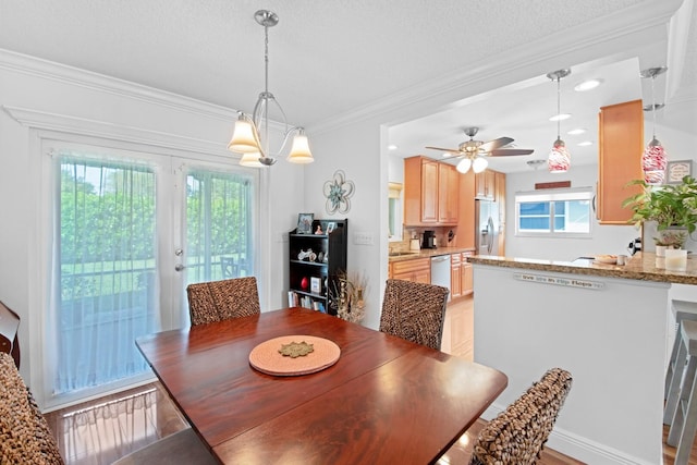 dining area featuring recessed lighting, a textured ceiling, and crown molding