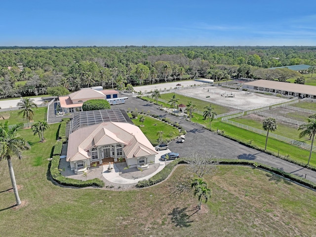 bird's eye view featuring a wooded view