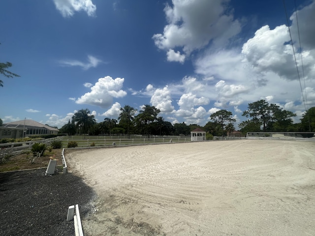 exterior space featuring an enclosed area and fence