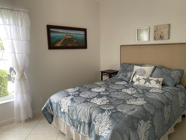 bedroom featuring tile patterned flooring