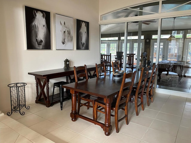 tiled dining area featuring french doors