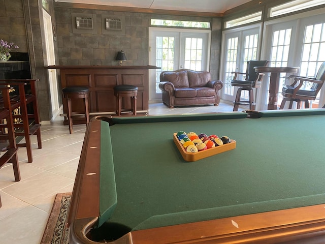 rec room with pool table, light tile patterned floors, and french doors