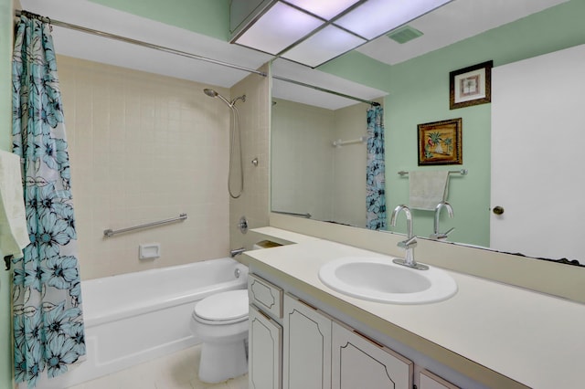 bathroom featuring visible vents, vanity, toilet, and shower / bath combo with shower curtain