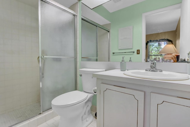 full bath featuring toilet, tile patterned floors, a shower stall, and vanity