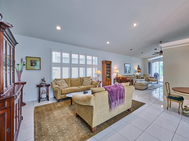 living area with light tile patterned floors, recessed lighting, and ceiling fan