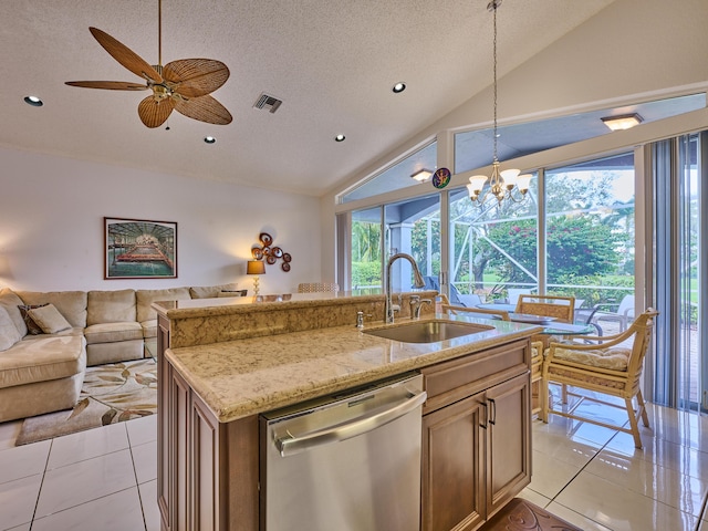 kitchen with light tile patterned floors, visible vents, a sink, vaulted ceiling, and stainless steel dishwasher