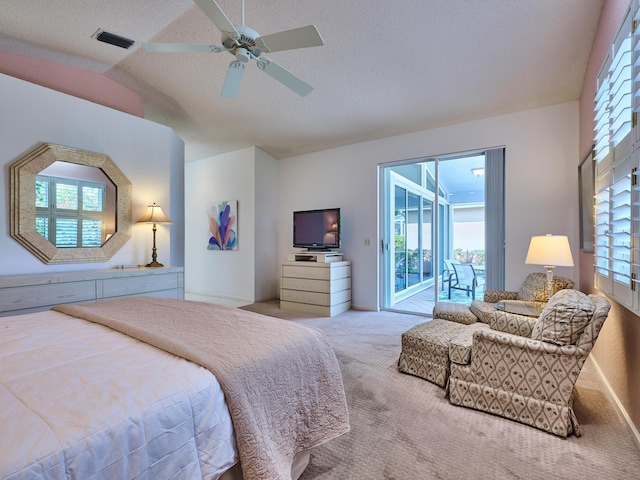 bedroom featuring visible vents, access to outside, a textured ceiling, carpet, and lofted ceiling