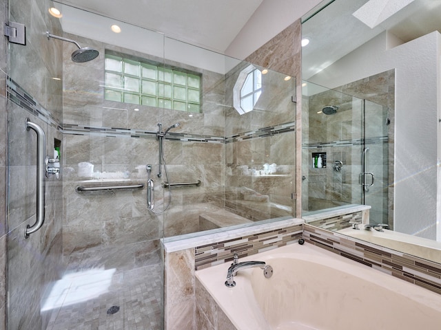 bathroom featuring a shower stall and a garden tub