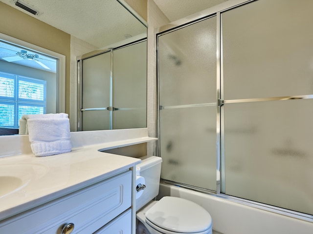 full bathroom with visible vents, a textured ceiling, ceiling fan, and vanity