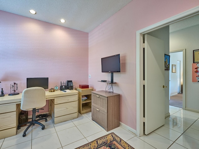 office space featuring light tile patterned floors, recessed lighting, baseboards, and a textured ceiling