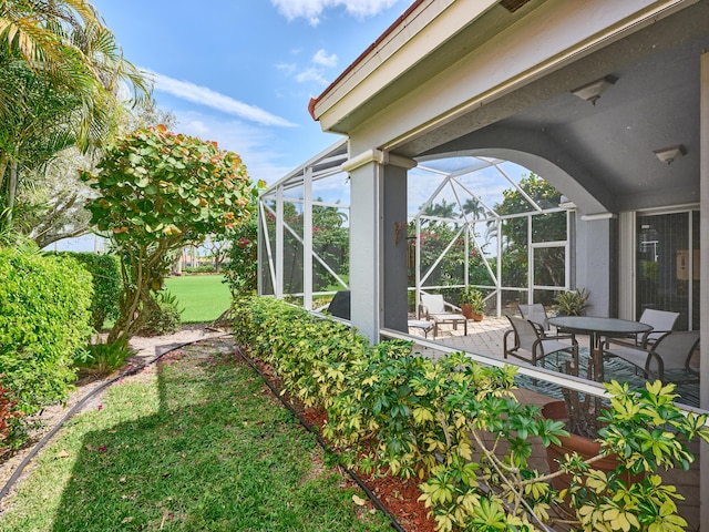 view of yard featuring a lanai and a patio area