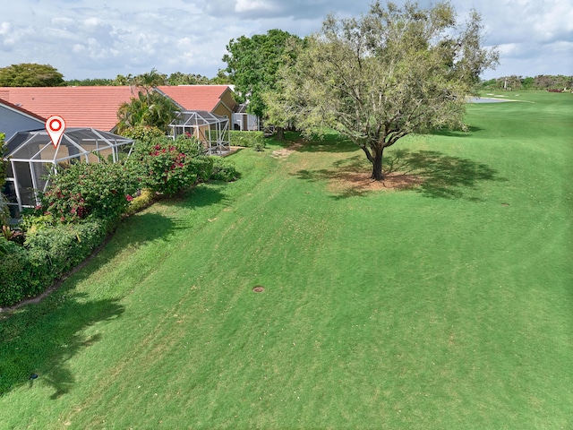 view of yard featuring glass enclosure