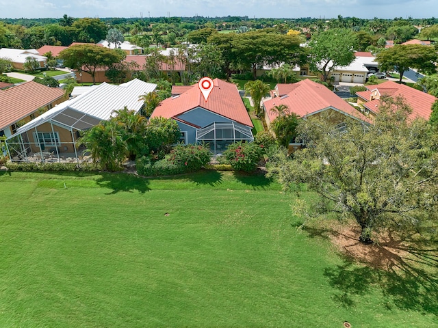 birds eye view of property with a residential view