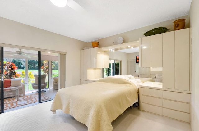 bedroom featuring access to exterior, vaulted ceiling, and light colored carpet