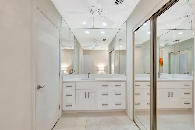 bathroom featuring ceiling fan, visible vents, tile patterned flooring, and vanity