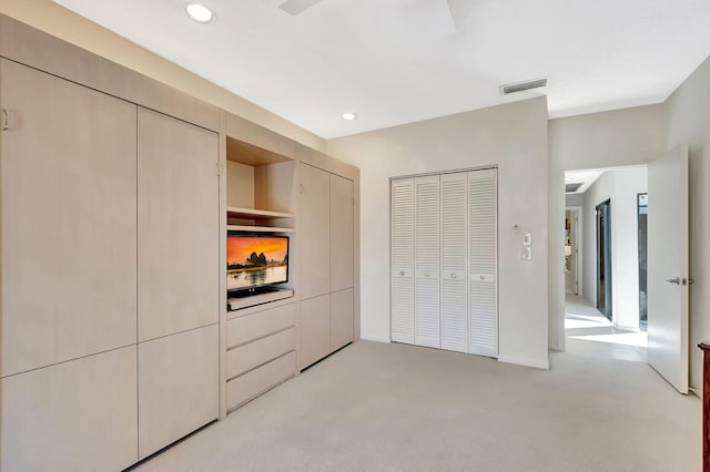 unfurnished bedroom featuring recessed lighting, light carpet, and visible vents