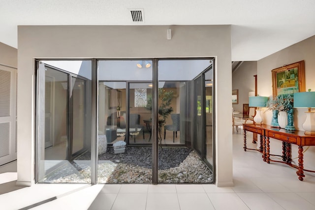 doorway to outside featuring visible vents