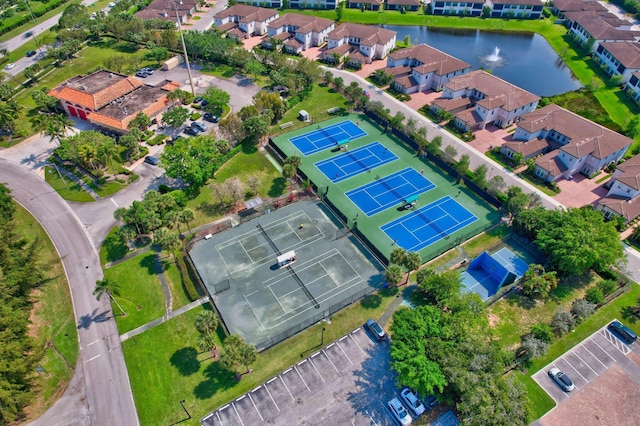 bird's eye view with a water view and a residential view