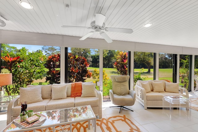 sunroom / solarium featuring ceiling fan and a wealth of natural light