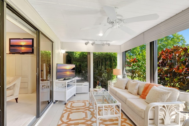 sunroom with ceiling fan and track lighting