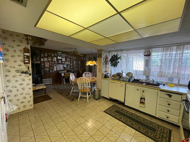 kitchen with light floors, visible vents, cream cabinets, a ceiling fan, and dishwasher