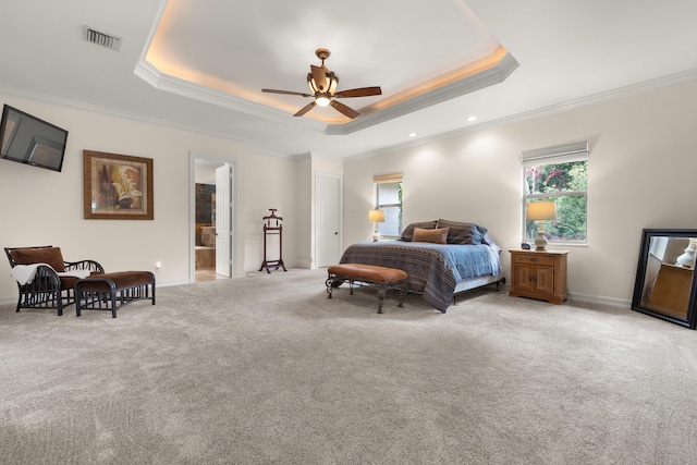 carpeted bedroom with visible vents, crown molding, baseboards, a tray ceiling, and recessed lighting