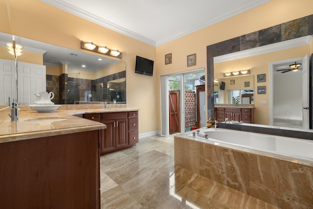 bathroom featuring two vanities, a stall shower, crown molding, and a sink