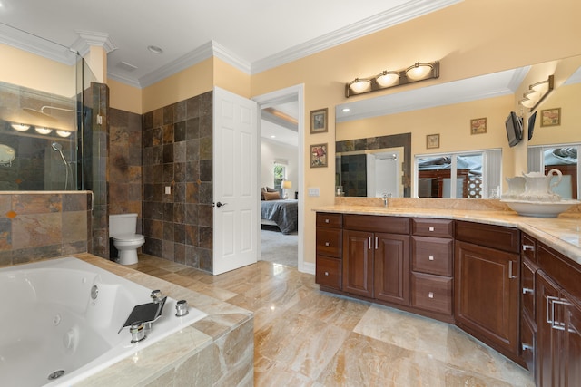 bathroom featuring toilet, a jetted tub, crown molding, tiled shower, and vanity