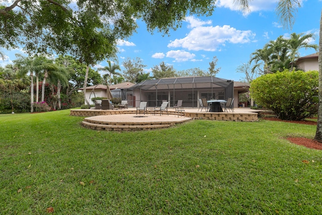 view of yard featuring a lanai and a patio area